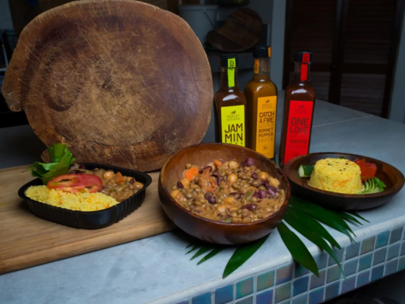 A bowl with Cedella's sauces at the One Love Cade