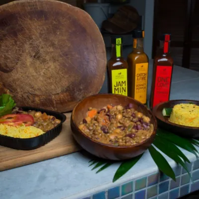 A bowl with Cedella's sauces at the One Love Cade