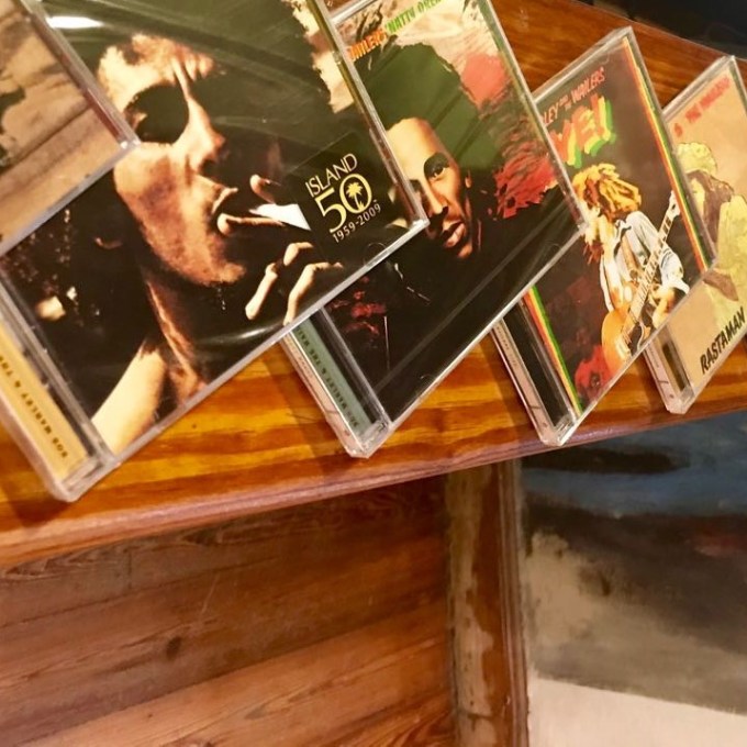 A selection of Bob Marley CDs on the table