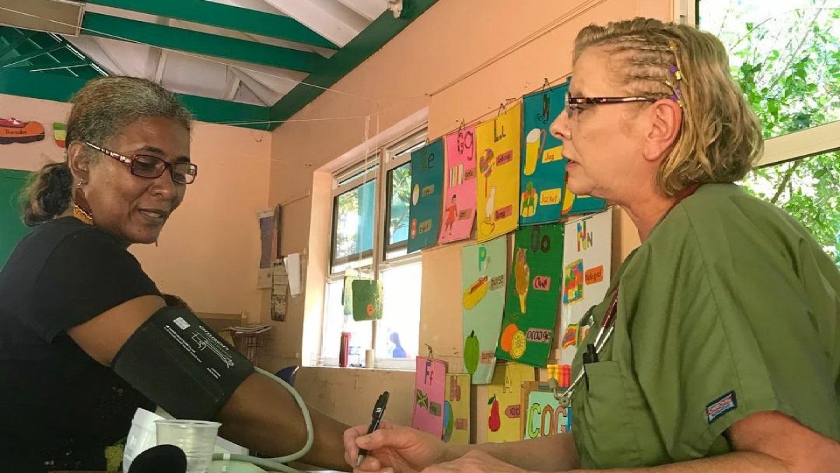 A woman getting her blood pressure checked